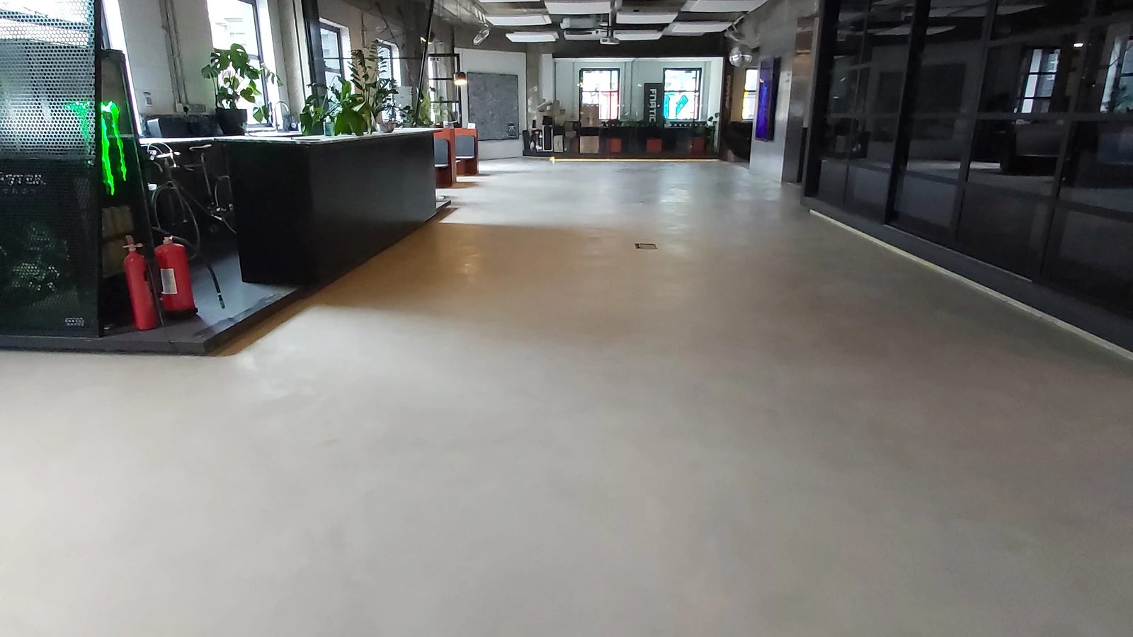 Commercial microcement flooring installation with the floor as the main focus
