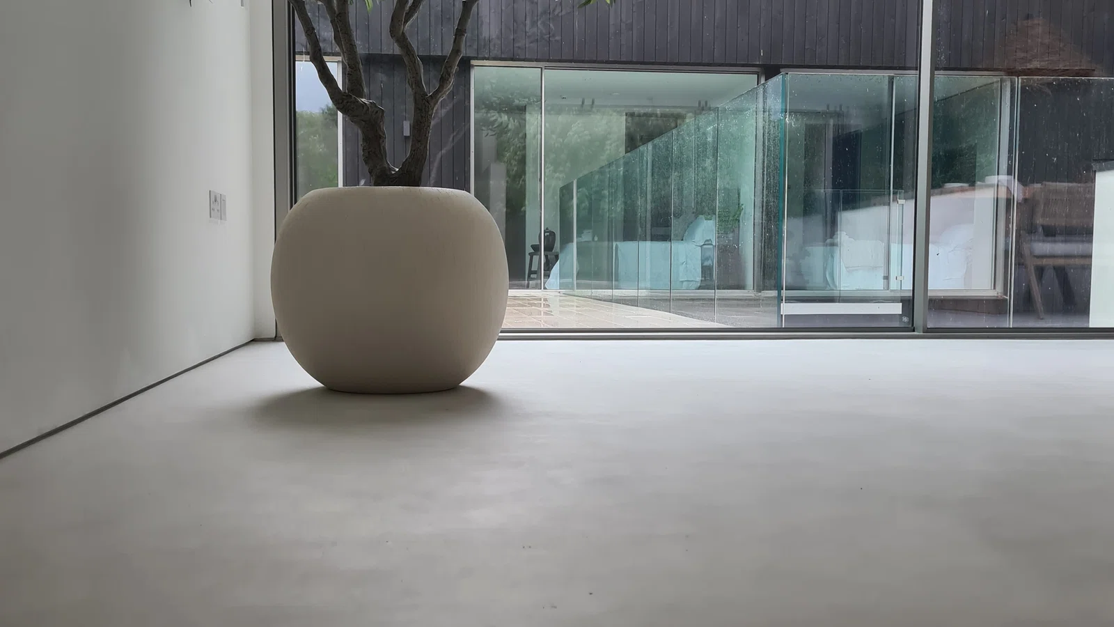 Completed concrete-style flooring project by Eco Microcement
